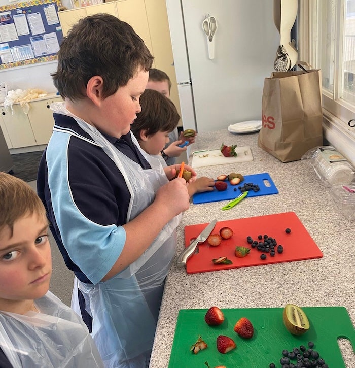 Image of students devleoping their culinary skills as well as literacy skills